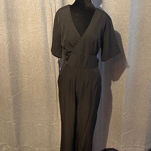 NWOT Black Jumpsuit, side pockets, zipper back and tie at the ankle